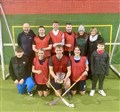 The Spey team and supporters show off the silverware after the victory at Dalfaber.