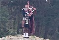 Spud the Piper salutes NHS workers on Carrbridge's famous bridge 