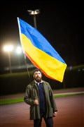 Man holding flag. Picture: Callum Mackay..