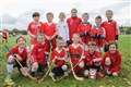 Gaelic Medium shinty Coaching Session taking place prior to the men and women's Mod Shinty Cup matches at Bught Park Inverness at The Royal National Mòd 2021 in Inverness, Scotland
