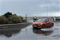Flood alerts as heavy rain sweeps in after ‘tornado’ hits south coast