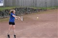 A side on view of the action at the Kingussie courts.