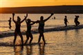Sub-zero temperatures fail to deter swimmers from sunrise dip