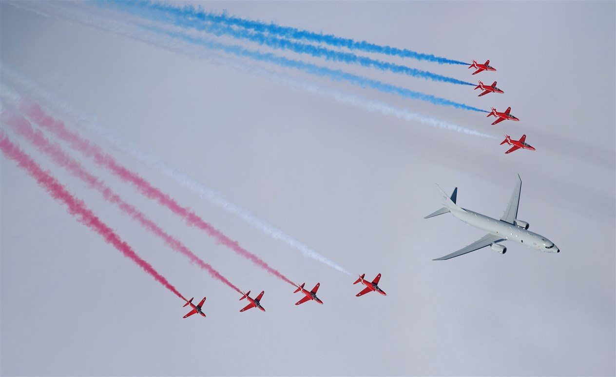 The Royal Air Force’s new submarine-hunter aircraft has flown in formation with the Red Arrows for the first time.