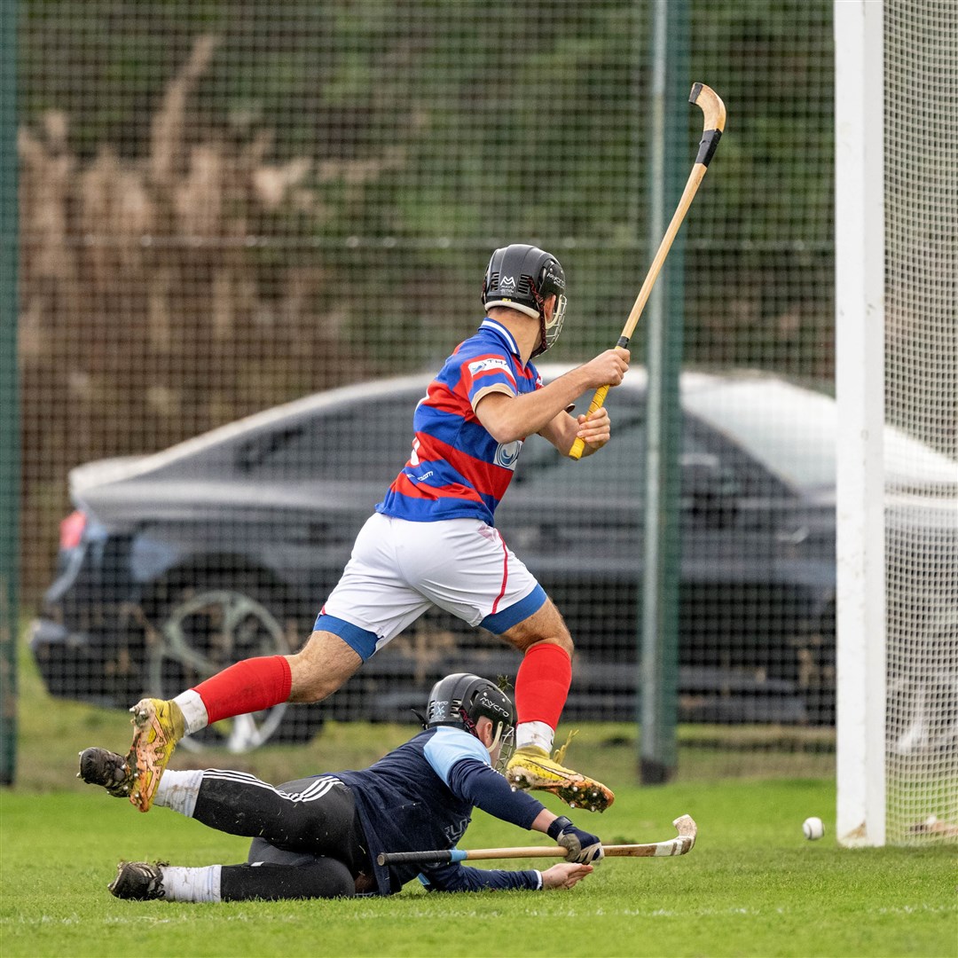 Kingussie's Eoin Baikie watches the ball cross the line for his goal. Picture: Neil Paterson.