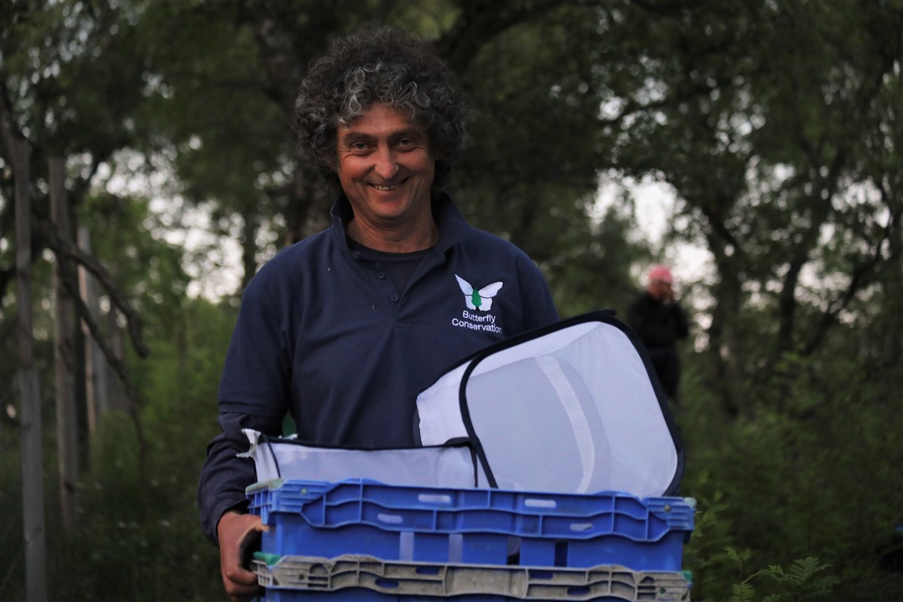 Butterfly Conservation Scotland conservation manager Tom Prescott gets ready to release some of the caterpillars.