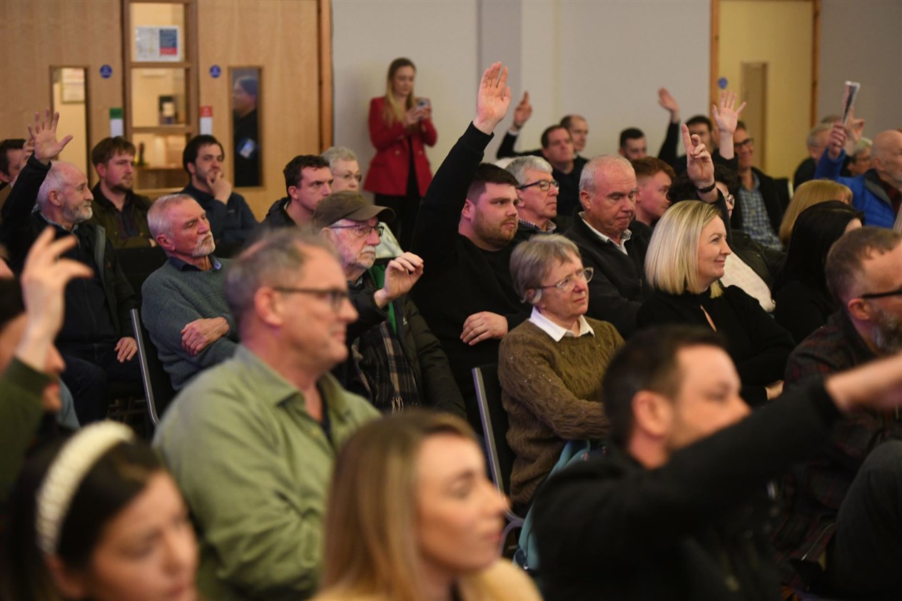 The audience put up their hands when asked if they feel let down and angry about the delay to the A9 dualling project. Picture: James Mackenzie.