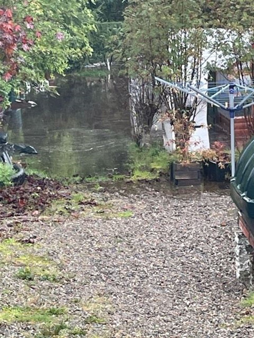 Flood waters at the rear of one of the street's properties.
