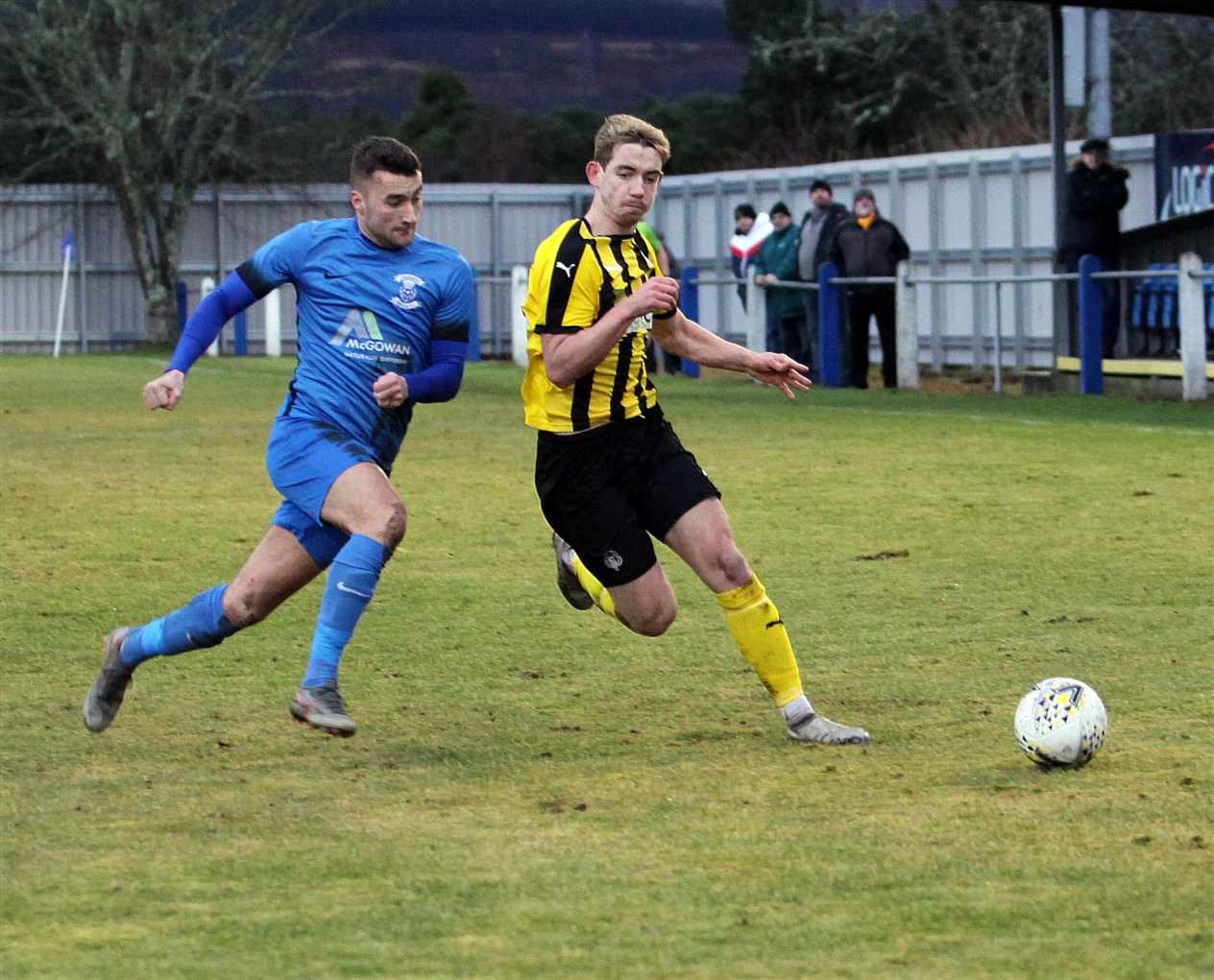 Thistle's Cameron Lisle (left) goes shoulder to shoulder with Liam Shewan (Nairn County).