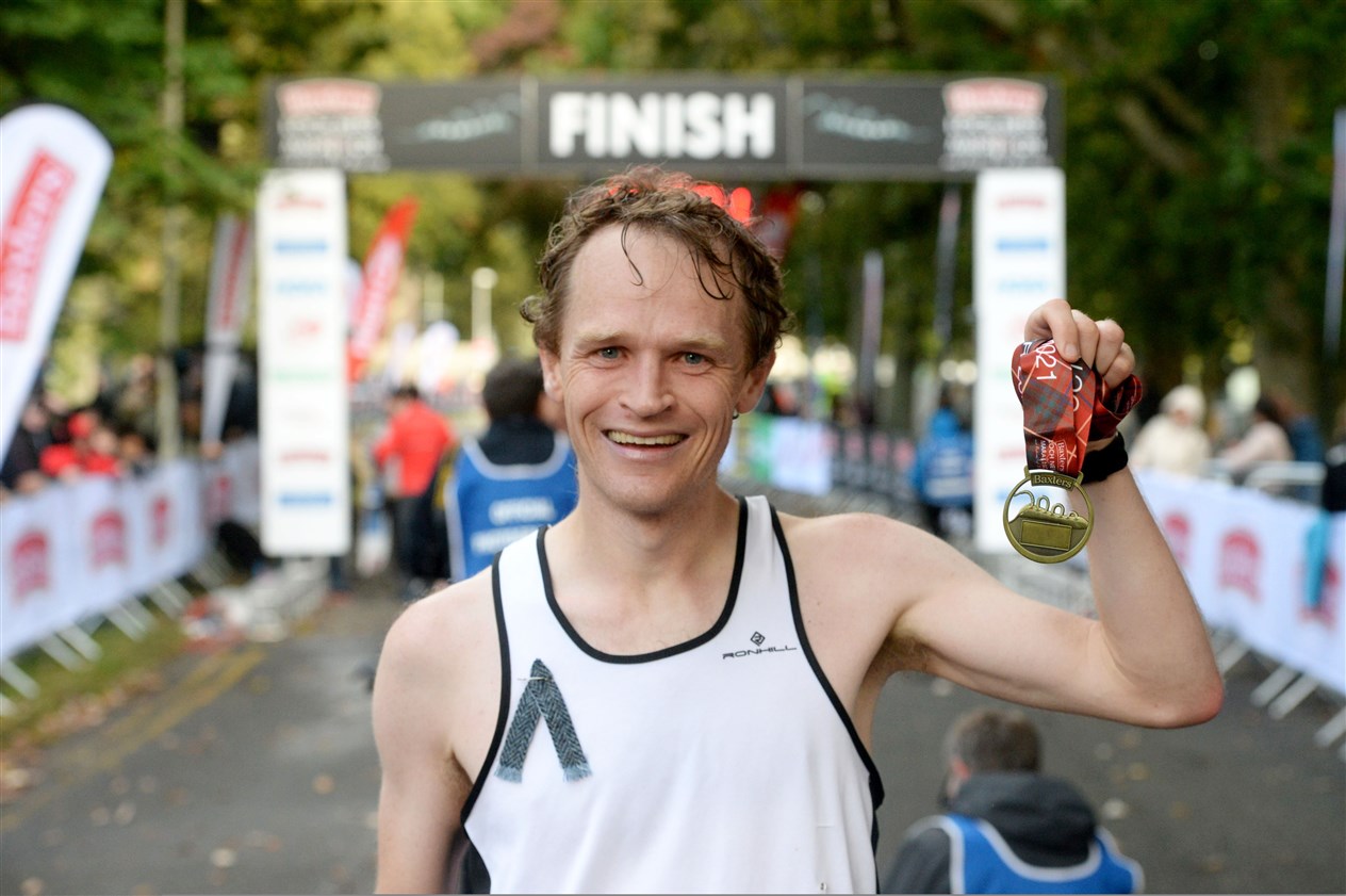 The mens winner was happy with his medal. Picture: James Mackenzie.