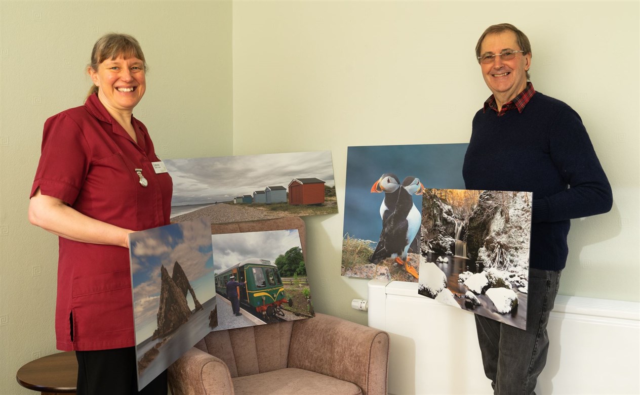 Duncan Rennie and Catherine Ellwood with some of his images.