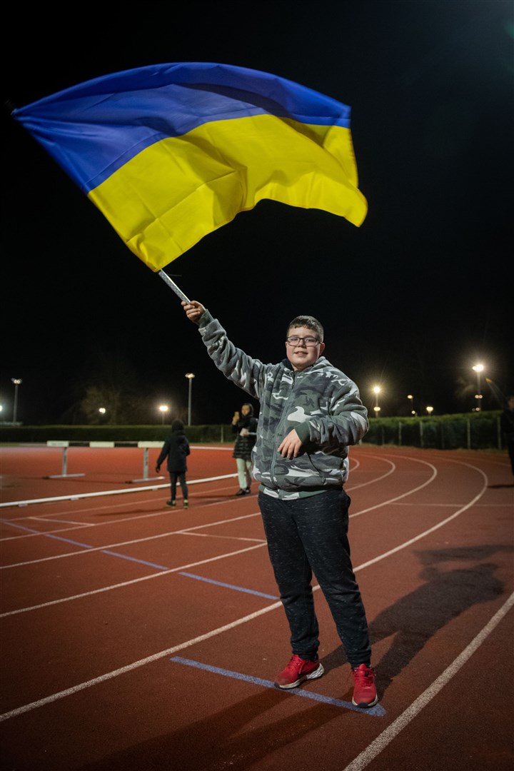 Boy with flag. Picture: Callum Mackay..