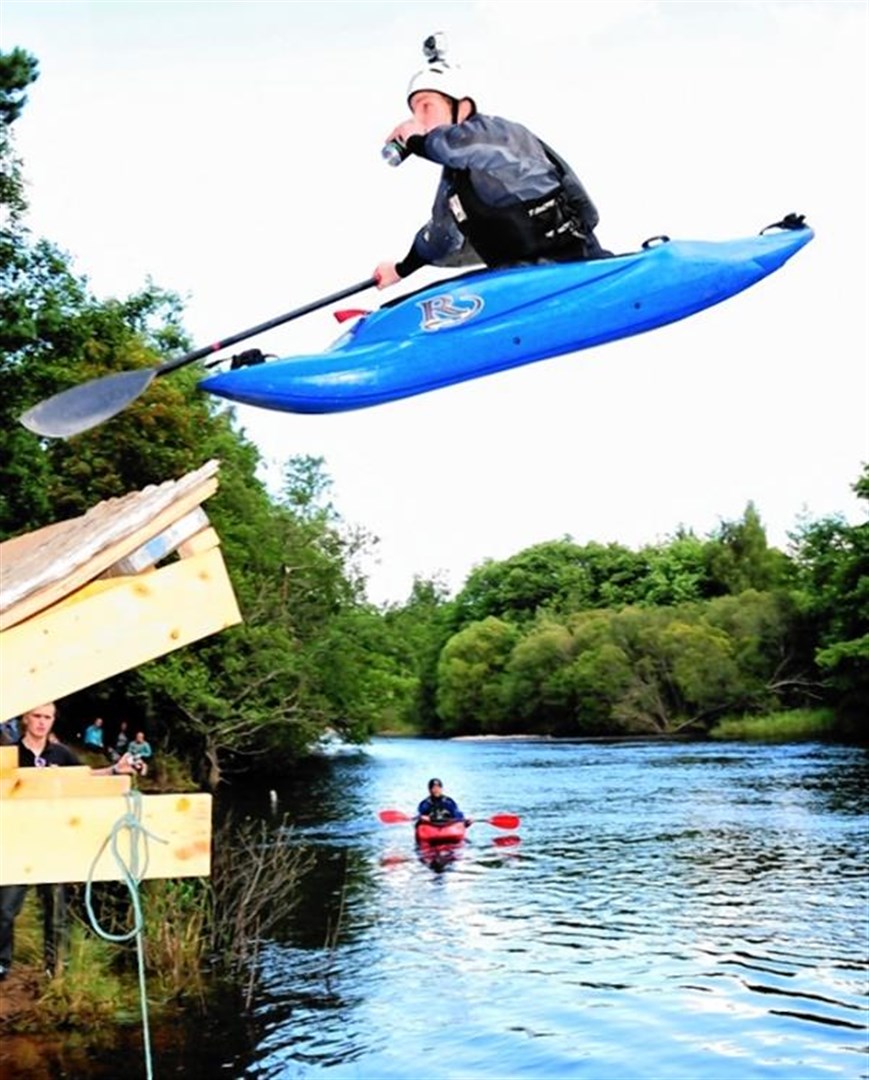A kayaker flies through the air (Robin McConnell)