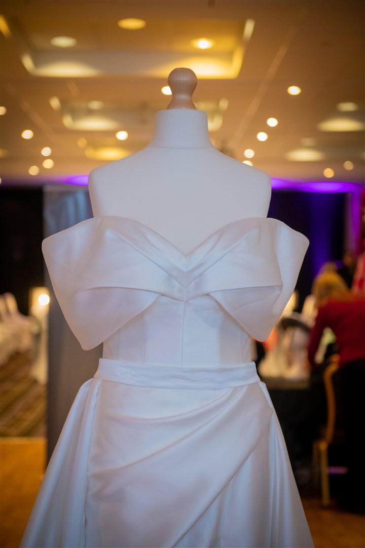 Show off those shoulders in this gown complete with large bow effect. Picture: Callum Mackay.