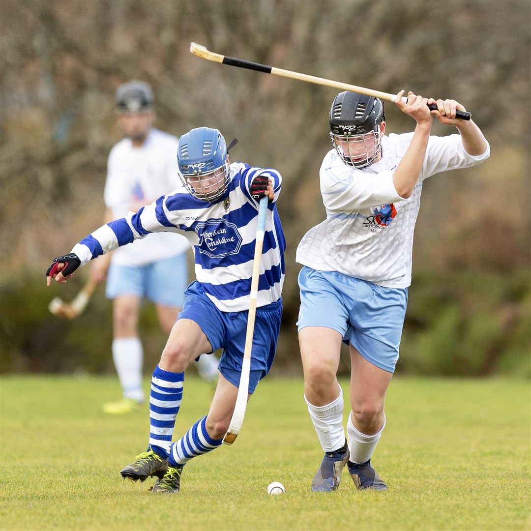 Newtonmore's Charlie Ferguson looks to block Skye's Cameron Mackay.
