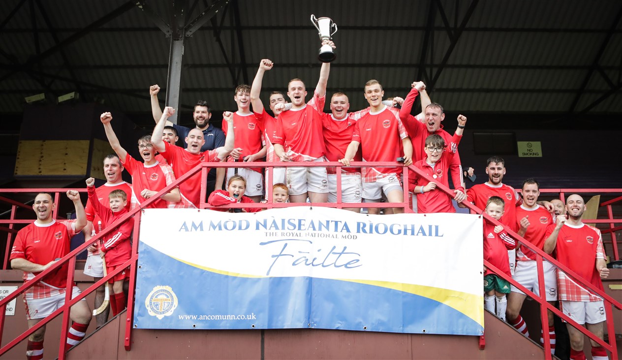 Inverness celebrate with The Aviemore Trophy after winning the Mòd Shinty Cup on penalties at Bught Park, Inverness during The Royal National Mòd 2021 in Inverness, Scotland, 9/10/21