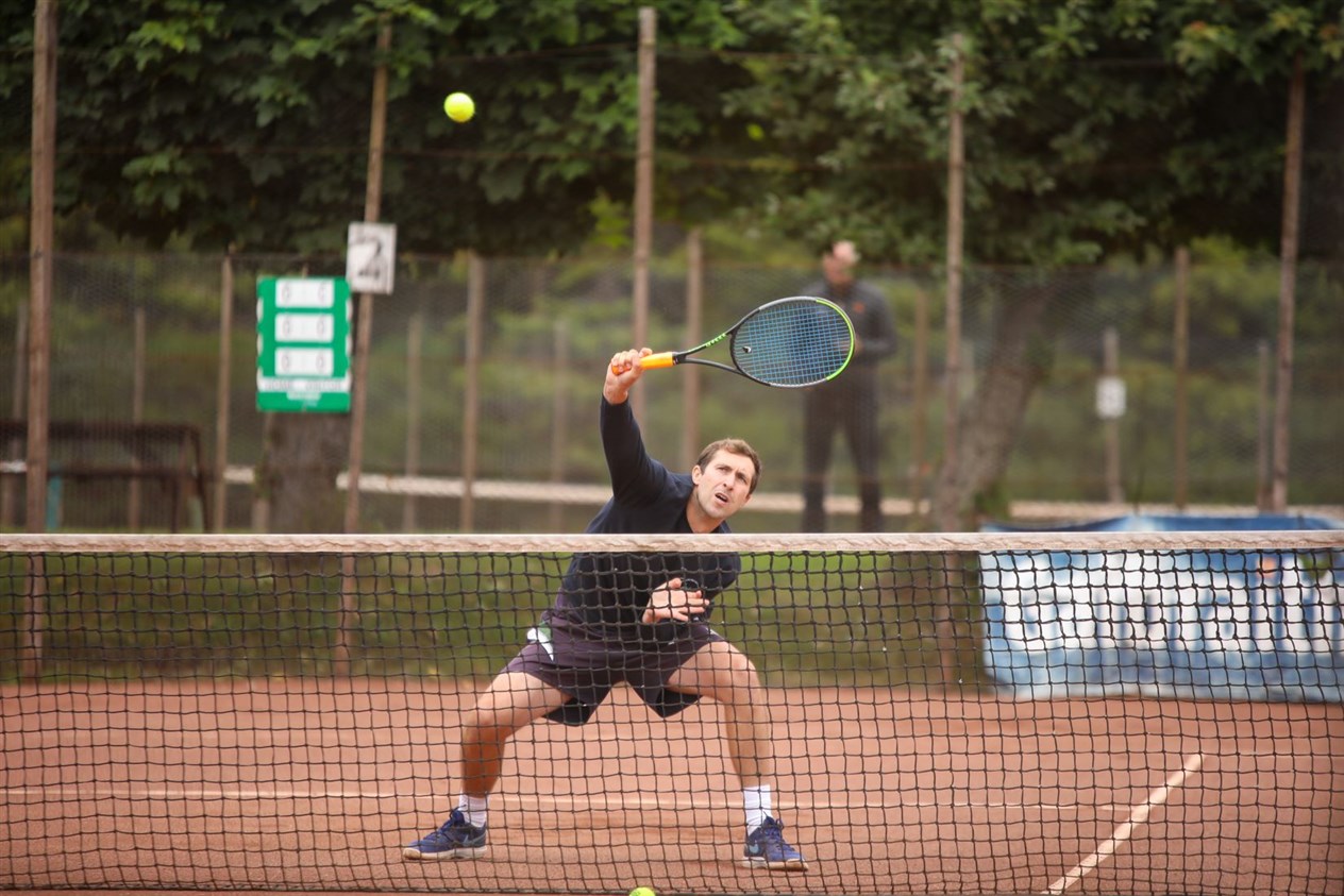 R&A COACH: Stephen Anniss in action in the men’s doubles.
