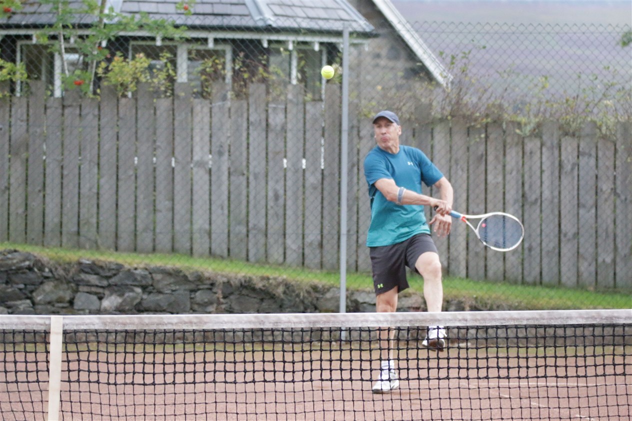 Grant Davis hits a ball with plenty of top spin.