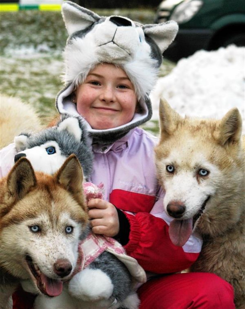 Rhianna Thomson (8) with two of the family members
