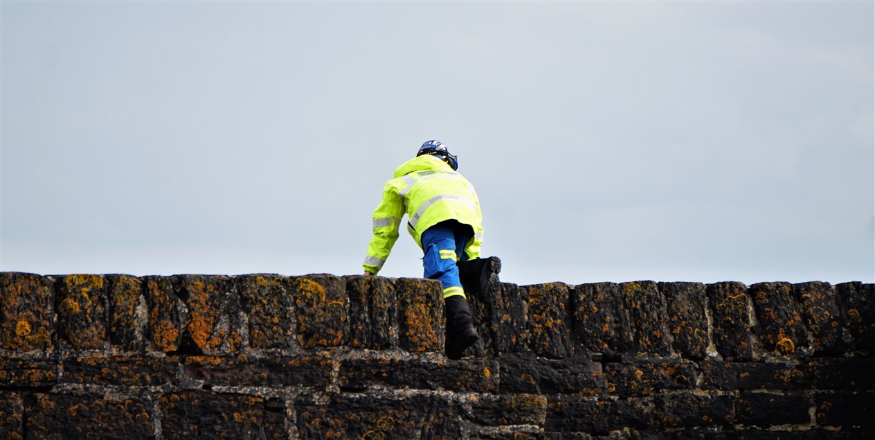 Coastguard personnel were seen searching around Keiss harbour. Picture: DGS