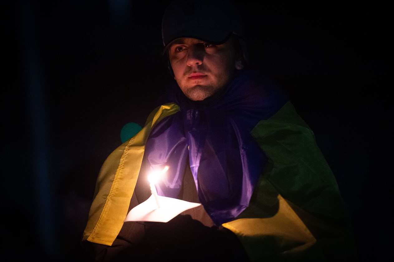 Man with candle. Picture: Callum Mackay..