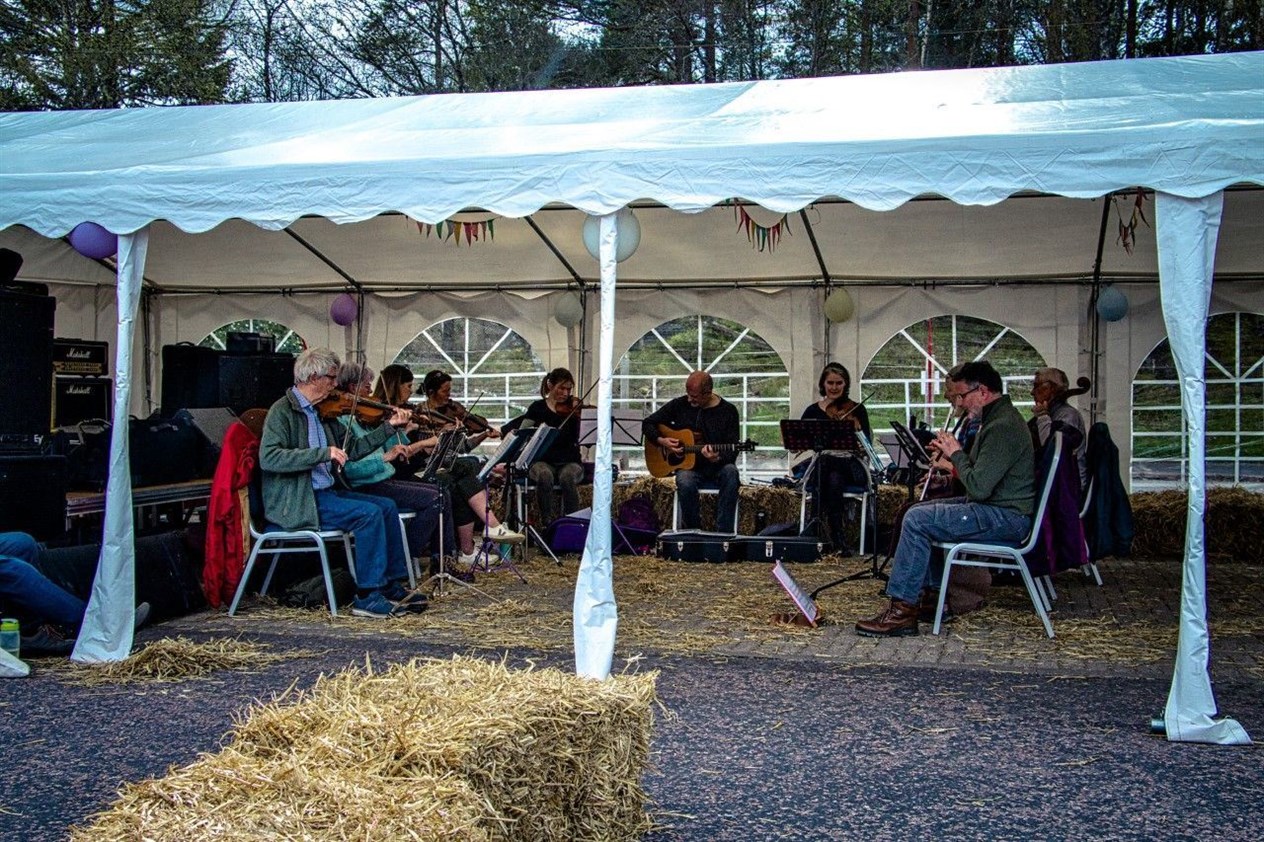 Local volunteers in a traditional music workshop provided entertainment throughout the day.