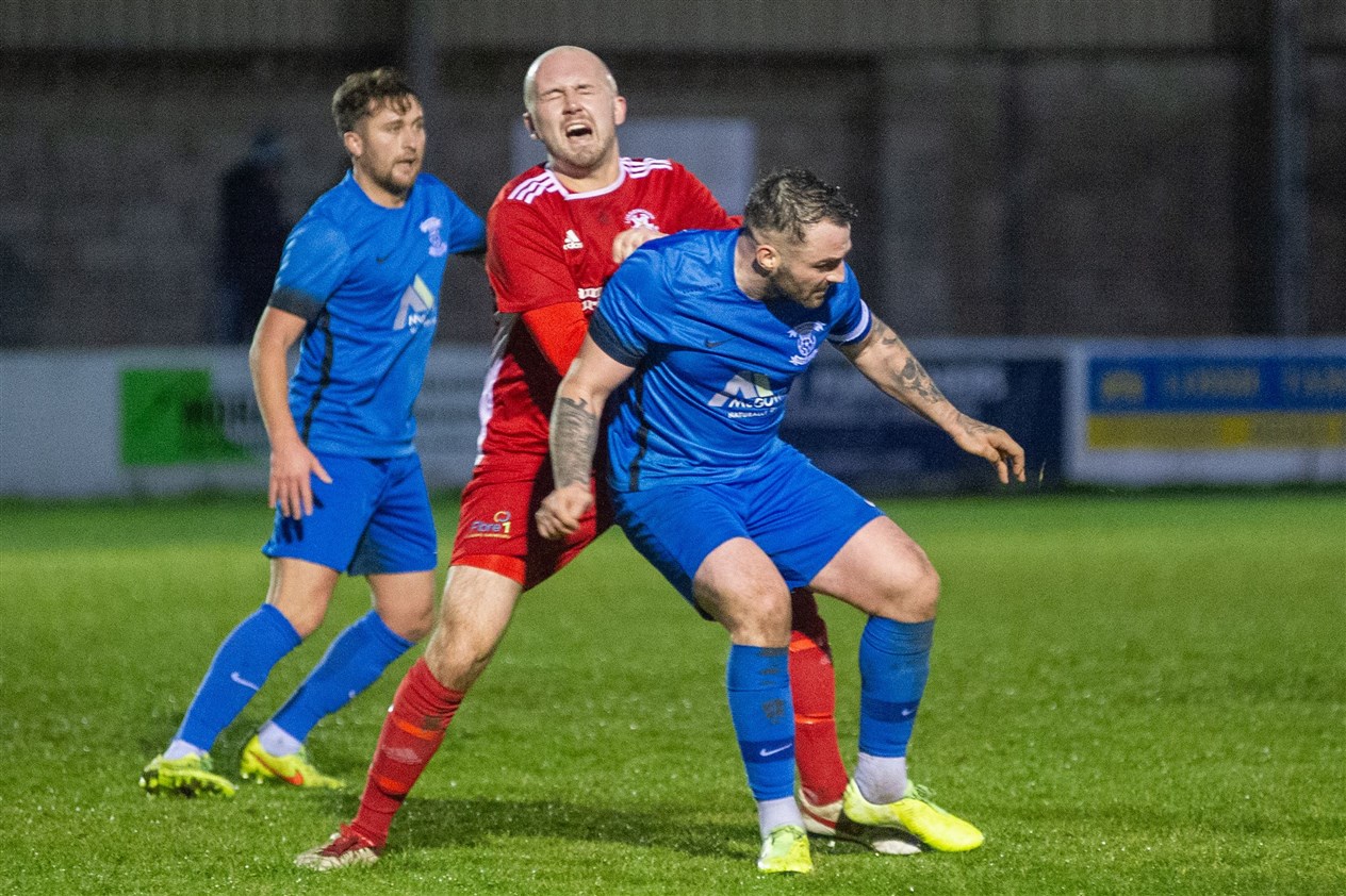 Lossie's Connor Macaulay cries in agony as James Fraser lands his studs on him.