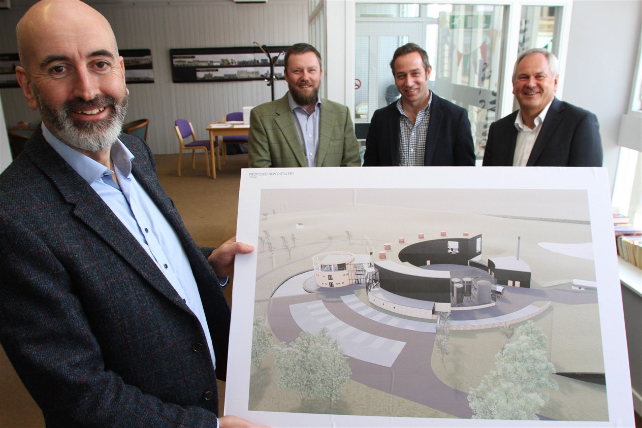 MD Ewen Mackintosh (left) shows off the eye-catching design during the pre-application consultation in Grantown as other project leaders look on.
