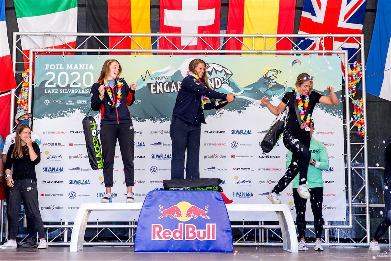 Watson (left) celebrates her silver medal on the podum. The windsurfing boards floating over the water are the trend of the last few years and will be included in the Olympic programme for the first time in 2024.