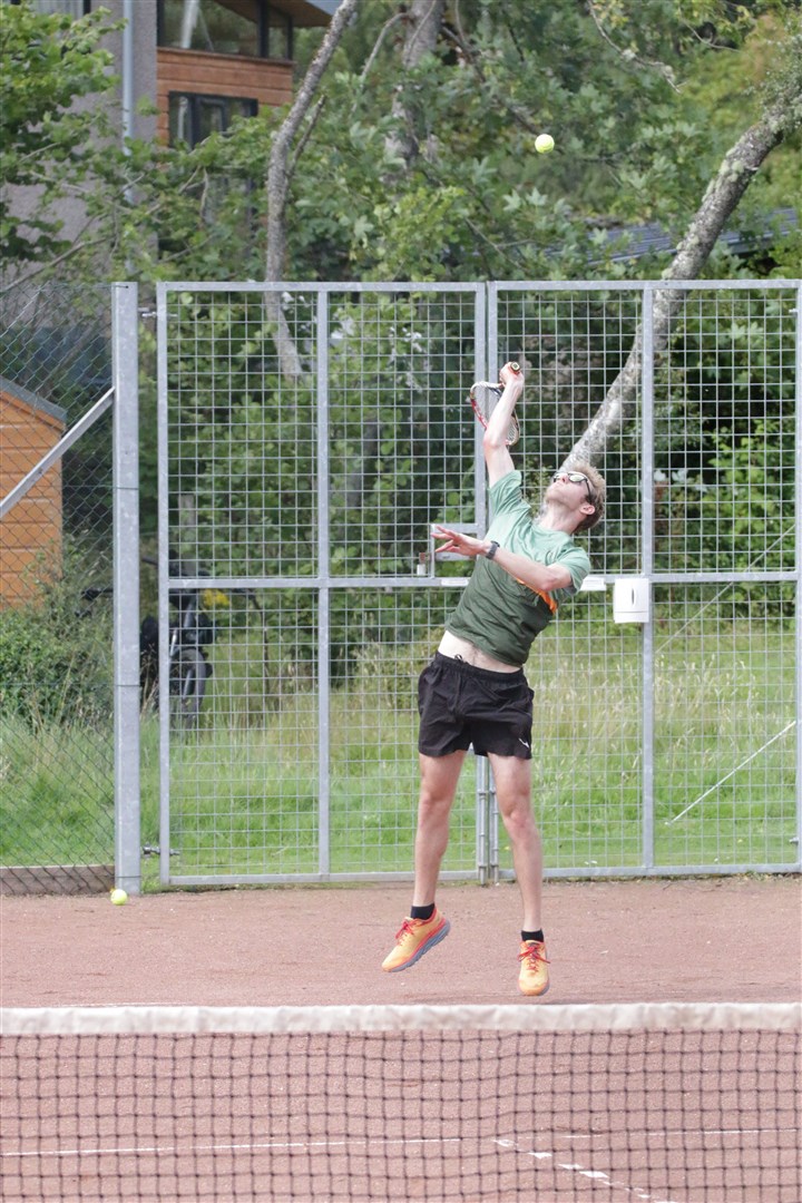 Daniel Donald fires in a serve.