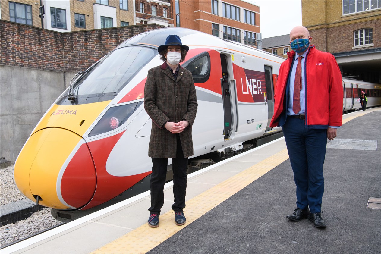 Railway historian Dr David Turner (left) and LNER Safety and Operations Director Warrick Dent pictured with the first LNER Azuma passenger service arriving through the newly reopened third tunnel. Photo: Matt Crossick/PA Wire