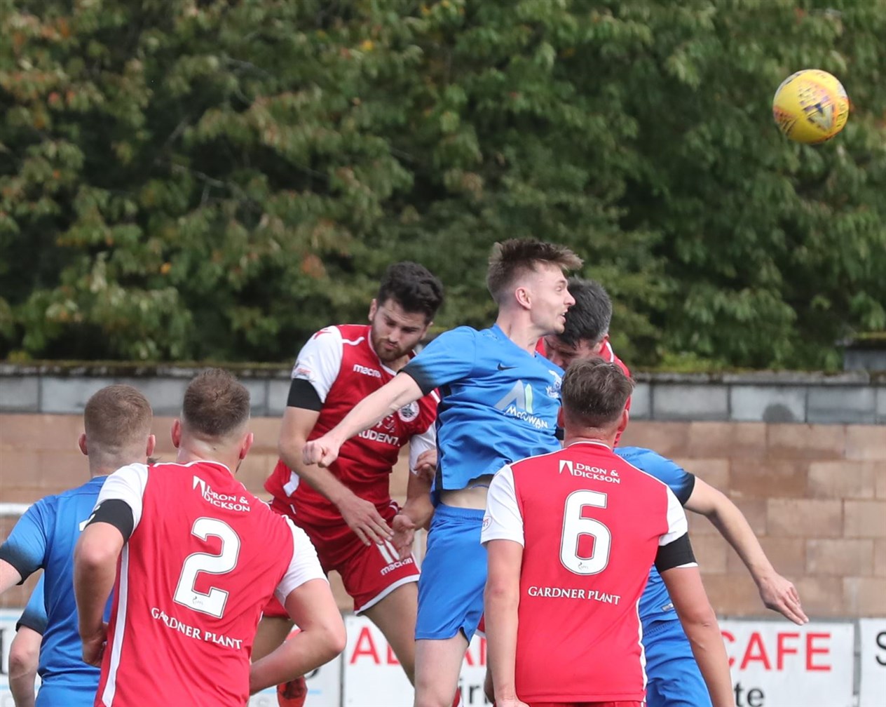 Andrew Hardwick rises highest to clear the danger from Thistle's penalty box. Pic: John Mcintyre