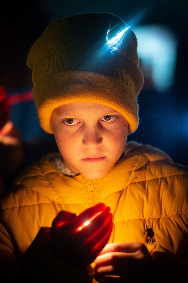 Boy with candle. Picture: Callum Mackay..