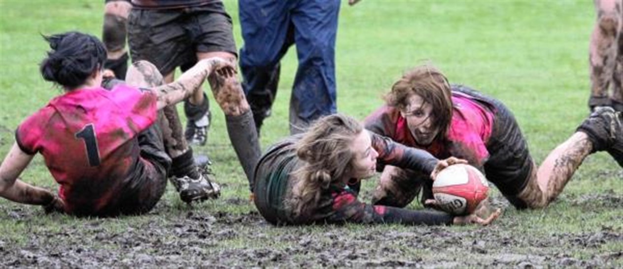 Louise Blair (left) and Aliesha Brown in the mud