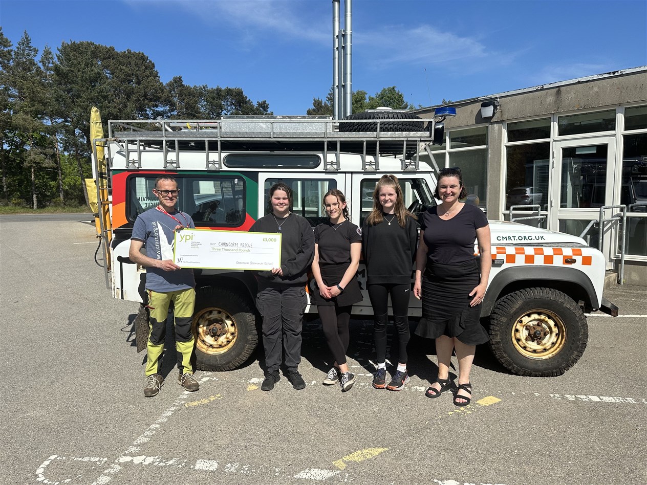 Duncan Scott, Paige Gray, Rhona Scott, Eilidh Neillie-Rutherford and Mrs McGonigal, presenting Mr Scott with the £3000 donation to the Cairngorm Mountain Rescue Team.