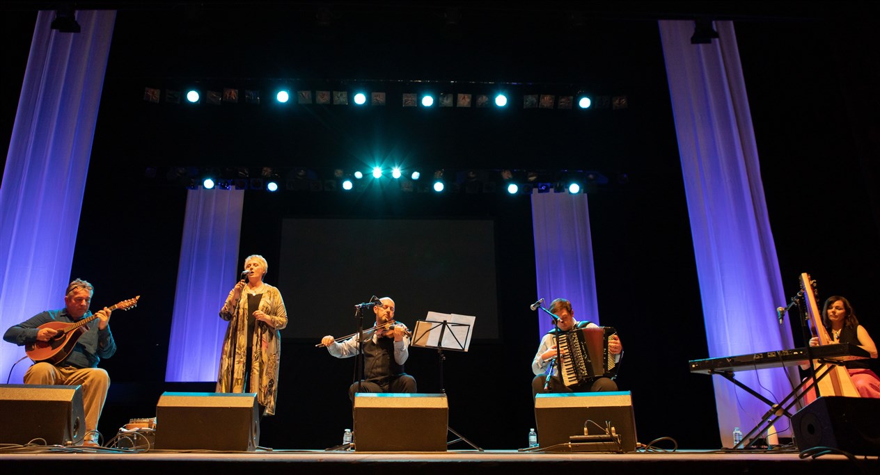 Glenfinnan Ceilidh Band perform on stage awith special guest Gaelic singer, Margaret Stewart Eden Court Theatre on the openng night of live music, The Royal National Mòd 2021