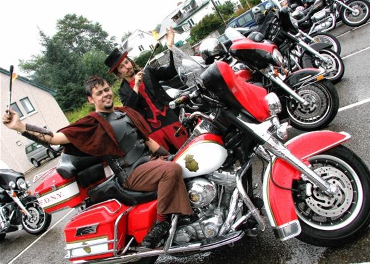 Fire-eating Harley fans Random Mike and Gareth Davis (seated) at the Kingussie rally