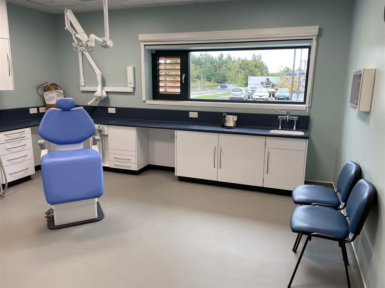 The dentist chair and wider room in the out-patients department.
