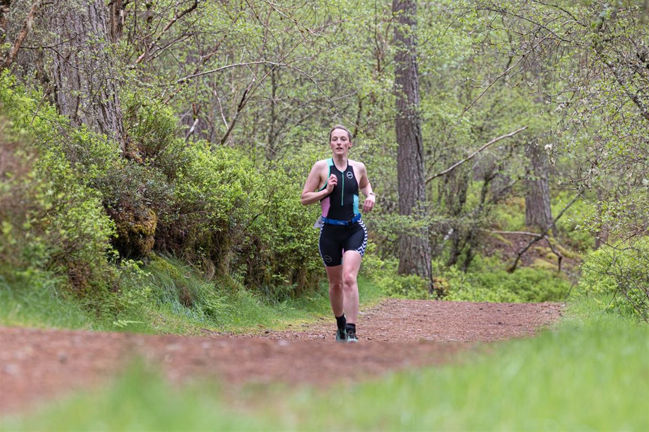 Women's open category winner Samantha Macleod on the running leg through the Anagach Woods. Picture: Jane Hope.