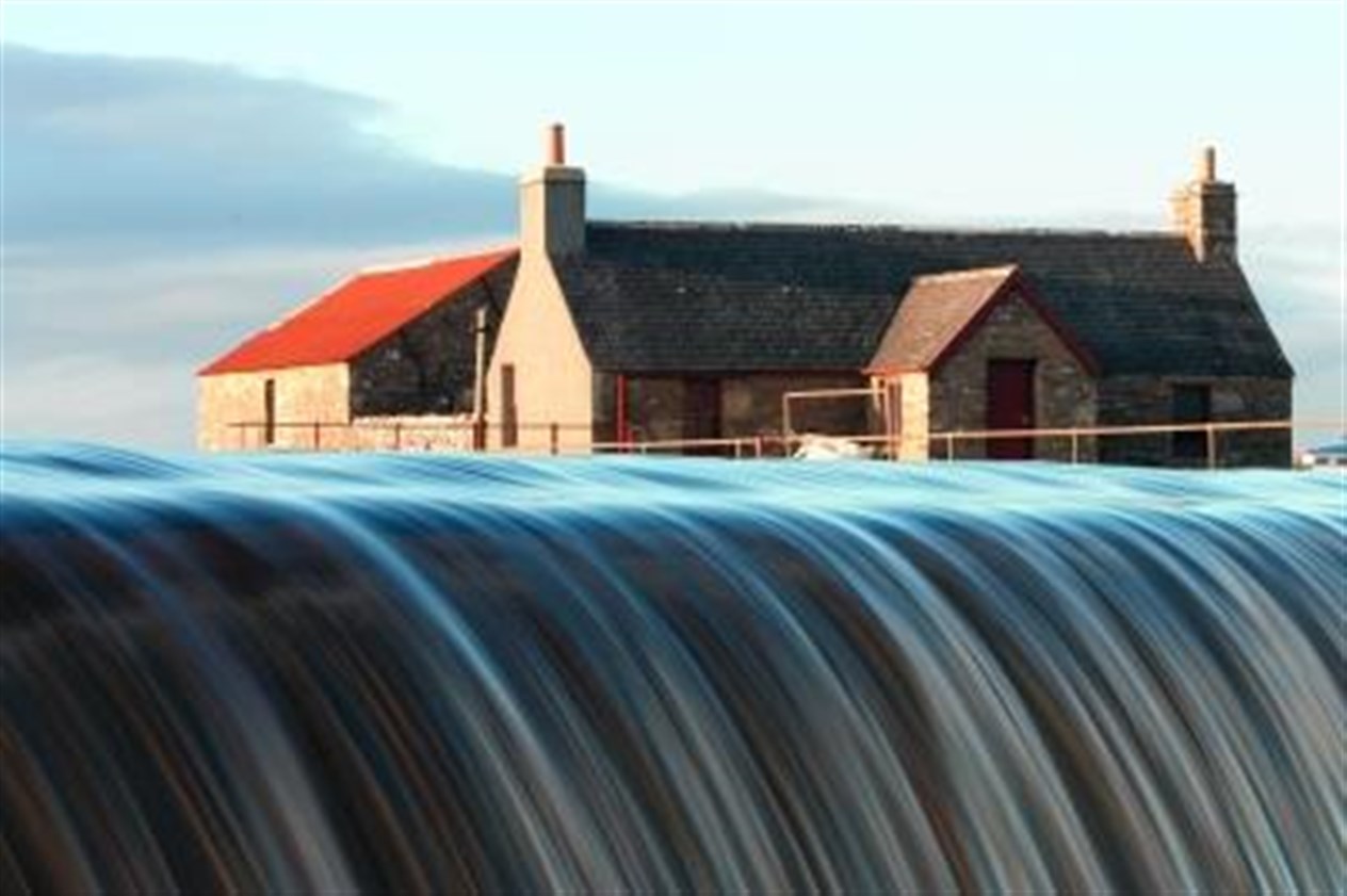Loch More dam and cottage by Michael Macleod of Harpsdale.