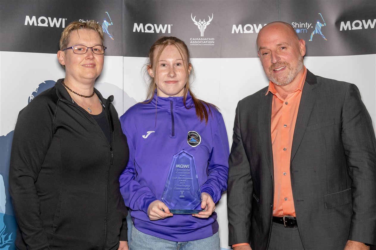 Strathspey Camanachd’s Fiona and Thea Stronach collect the WCA Club Development Award. All awards pictures: Neil Paterson.