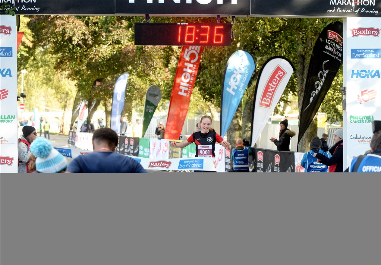 Caitlyn Heggie crossing the finish line. Picture: James Mackenzie.