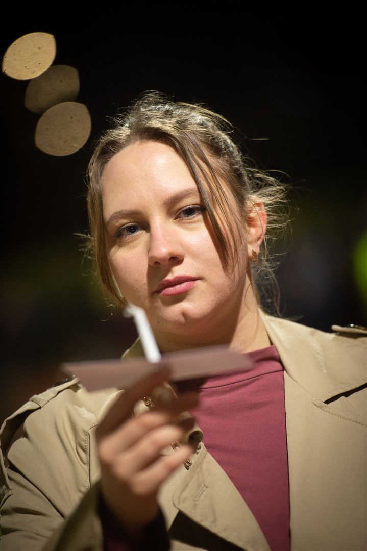 Woman with candle. Picture: Callum Mackay..