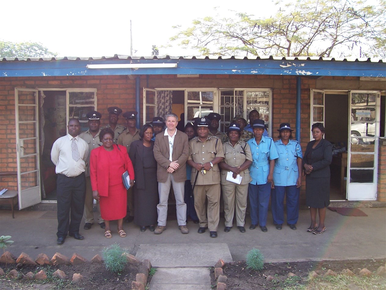 Mr Walker with Malawi police force members and officials at the victim crime support unit in 2010 that he helped to fund.