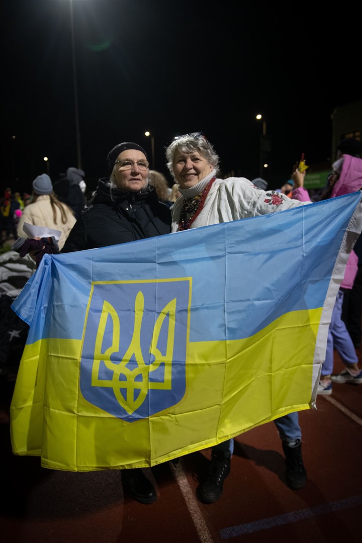 Women with flag. Picture: Callum Mackay..