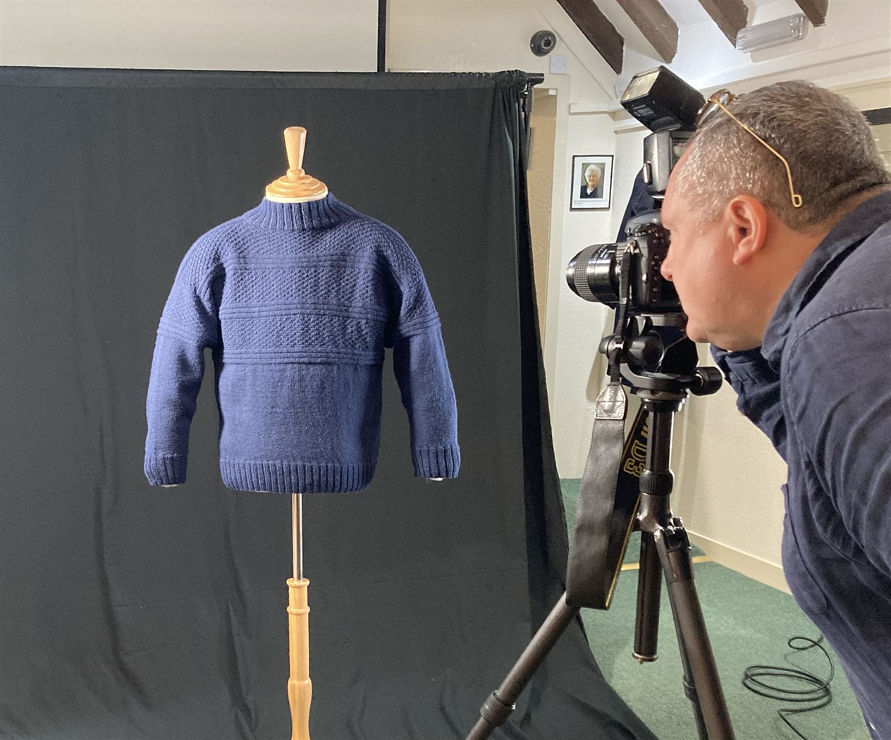 Jim Dunn photographing a gansey in Wick Heritage Museum.