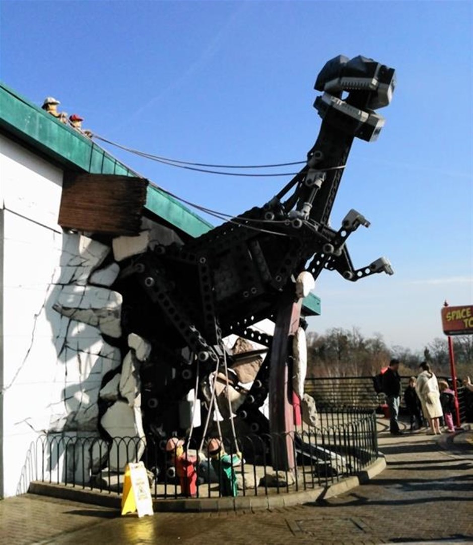 A dinosaur tries to break out of the theme park