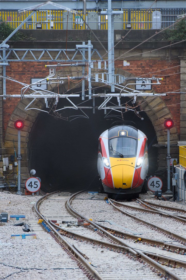 The first LNER Azuma passenger service arriving through the newly reopened third tunnel on platform 0 at London King’s Cross Railway Station, London. Photo: Matt Crossick/PA Wire