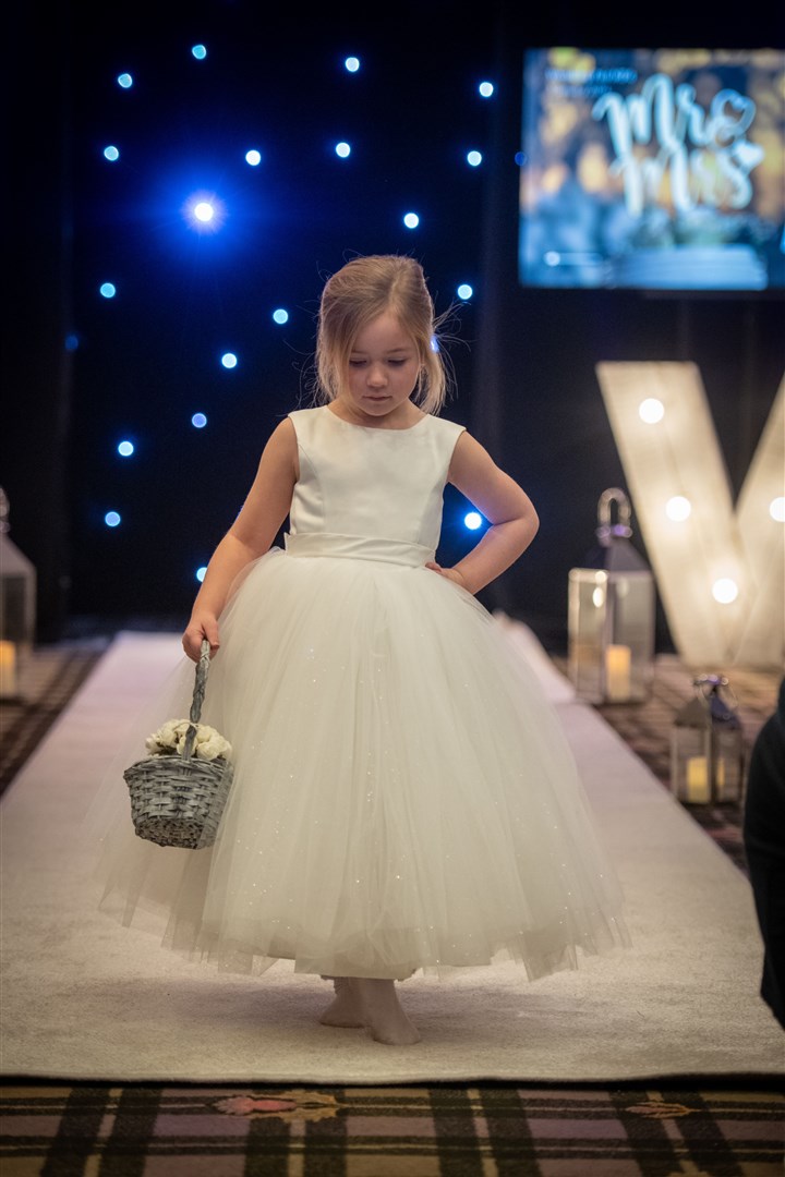 A cute flower girl showing off this lovely dress. Picture: Callum Mackay.
