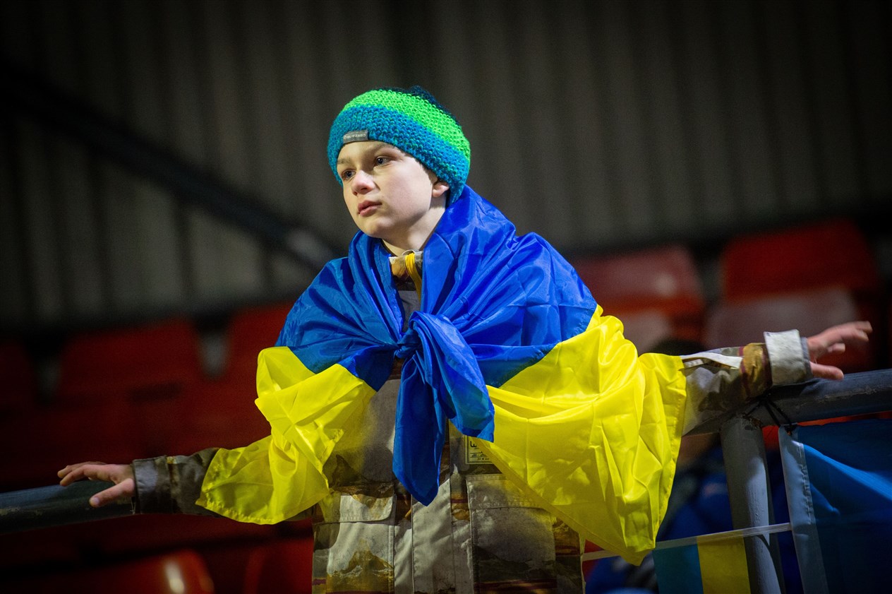 Boy with flag wrpped round his shoulders. Picture: Callum Mackay..